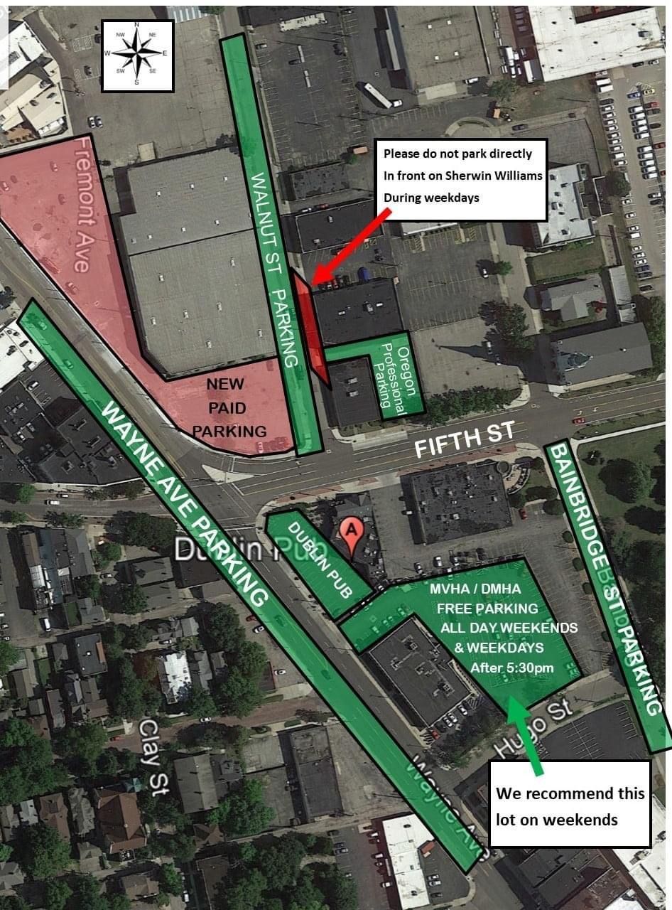 Aerial map showing public parking areas in green near Wayne Ave and Fifth St, with notes on weekend and evening access.