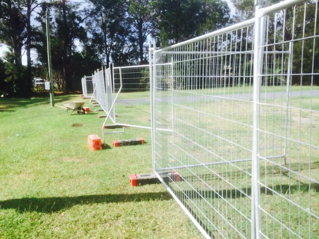 A Temporary Fence in the Middle of a Grassy Field — Coffs Coast and Country Temp Fence in Sapphire Beach, NSW