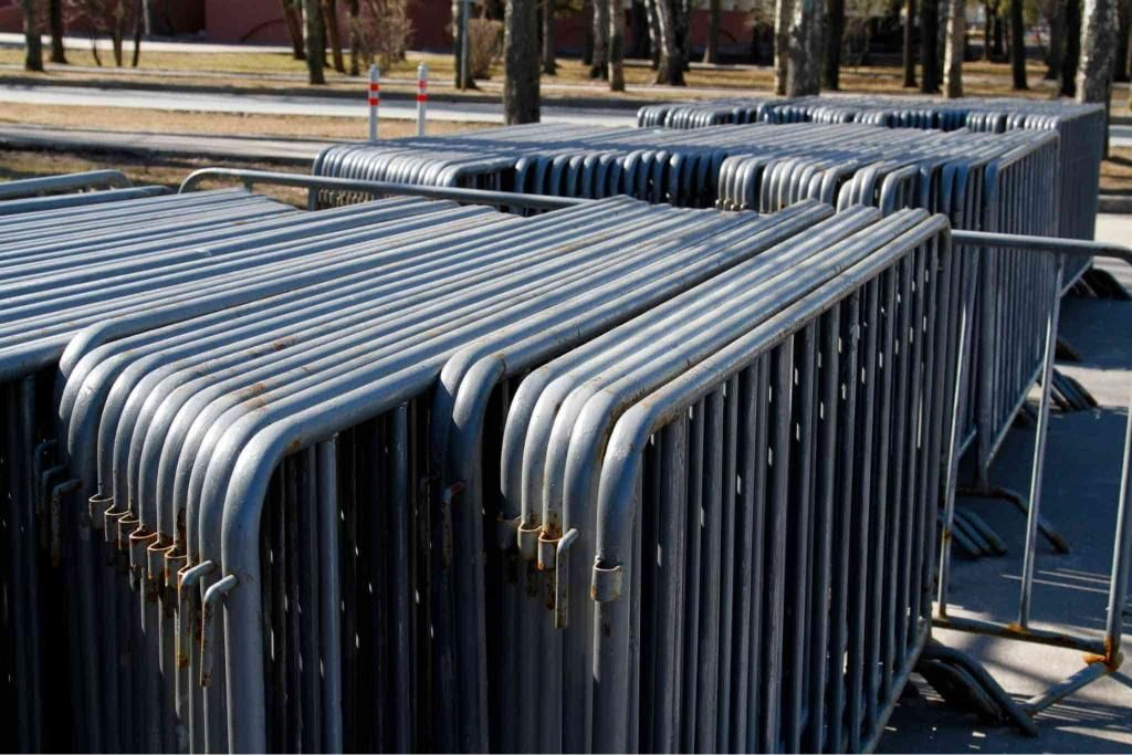 A Bunch of Metal Barriers Are Stacked on Top of Each Other — Coffs Coast and Country Temp Fence in Sapphire Beach, NSW