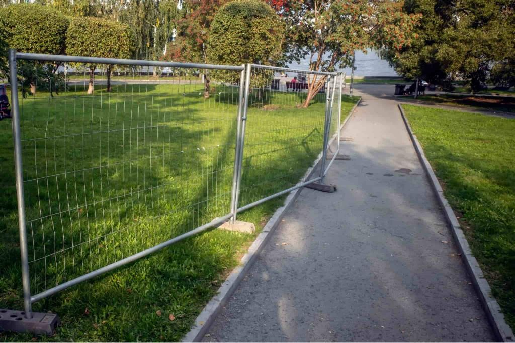 A Temporary Metal Fence is Blocking a Path in a Park — Coffs Coast and Country Temp Fence in Sapphire Beach, NSW