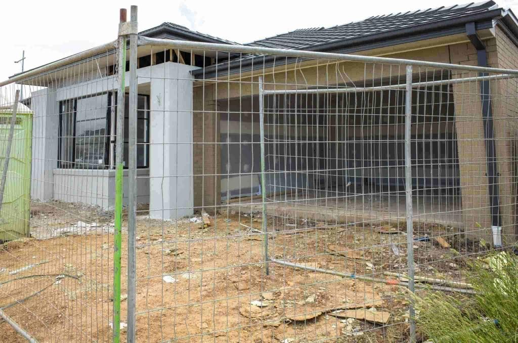 A House Under Construction is Behind a Temporary Fence — Coffs Coast and Country Temp Fence in Sapphire Beach, NSW