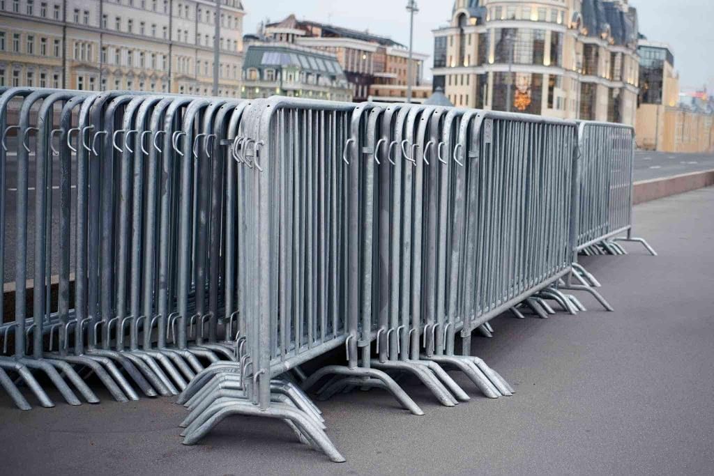 A Row of Crowd Control Barriers Are Stacked — Coffs Coast and Country Temp Fence in Sapphire Beach, NSW