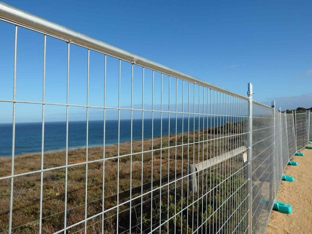 A Temporary Fence With a View of the Coast Behind It — Coffs Coast and Country Temp Fence in Sapphire Beach, NSW
