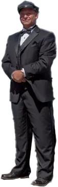 Man in a black suit and cap standing with hands clasped, isolated on a white background