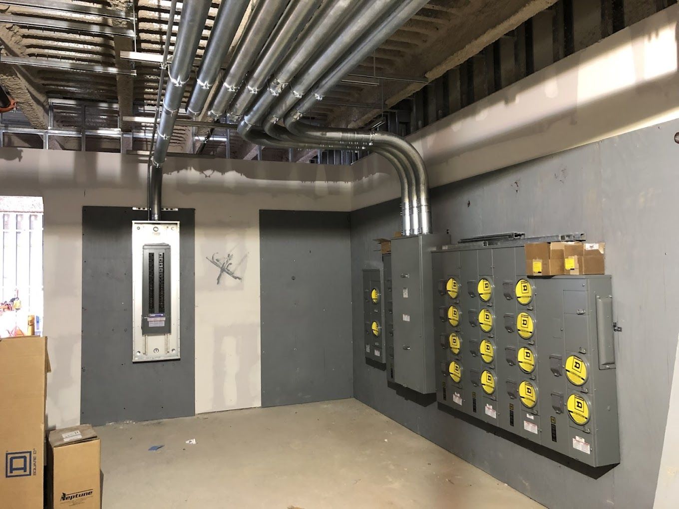A room with a lot of electrical equipment on the wall