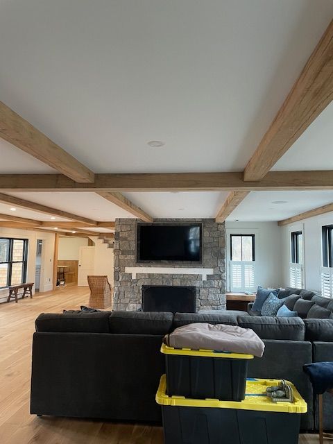 A living room with a couch and a fireplace