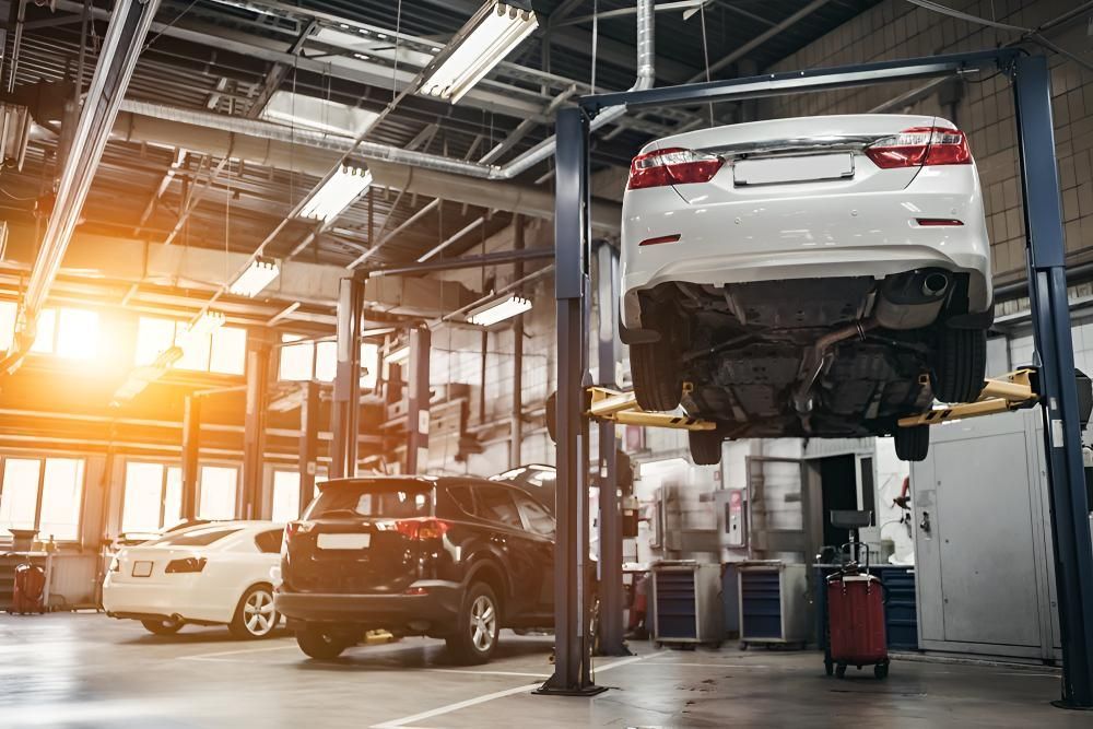 A Car Is Sitting On A Lift In A Garage — Stanger Automatics In Ballina, NSW