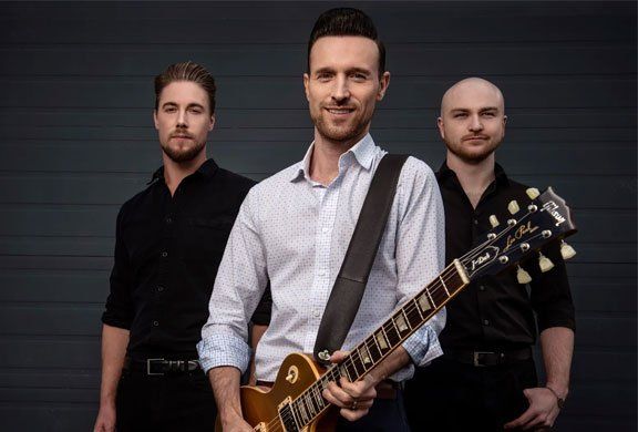 Image may contain guitar, men, shirt