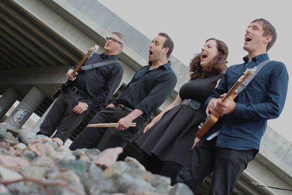 Image may contain woman, man, guitars, highway overpass