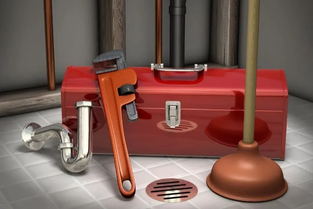 Red toolbox with plumbing tools including wrench and plunger on a tiled surface. Red toolbox with plumbing tools including wrench and plunger on a tiled surface.