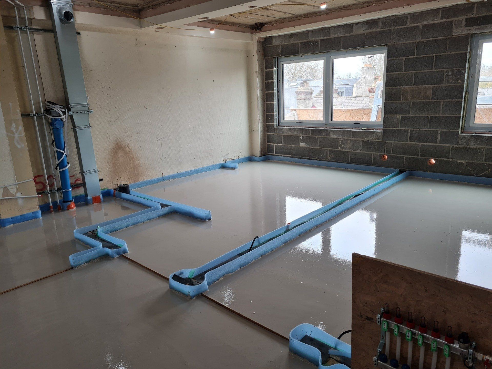 Gypsum screed installed around the wall sole plates, before the walls were built.