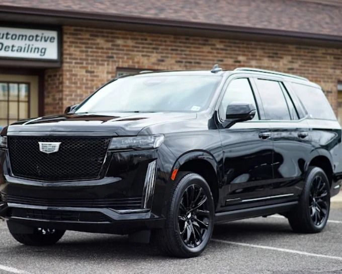 Black Cadillac SUV featuring premium ceramic coating and a sleek polished exterior.