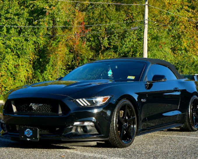 Black Ford Mustang with window tint showing ceramic tint vs regular tint comparison