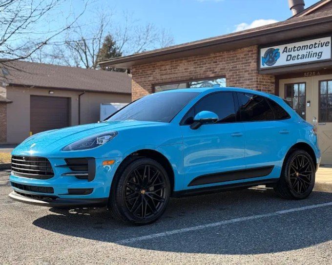 Blue luxury SUV with ceramic coating enhancing its shine and exterior protection.