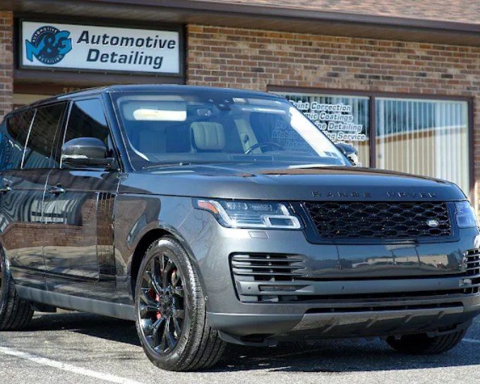 Gray Land Rover Range Rover outside M&G Automotive Detailing after window tint for heat rejection
