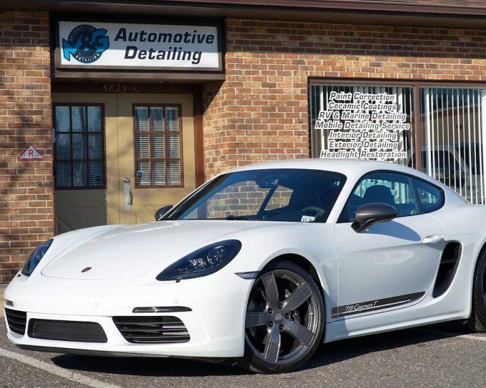 White Porsche 718 Cayman outside M&G Automotive Detailing after professional window tinting