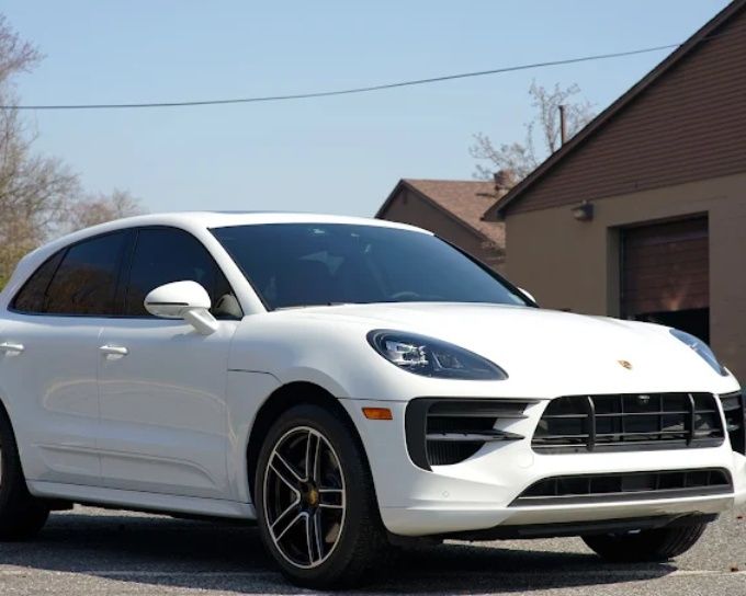 White Porsche Macan with professionally applied window tint for heat rejection and added privacy
