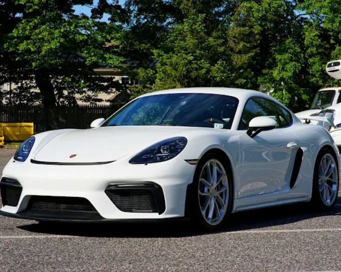 White Porsche sports car featuring ceramic coating with a clean, polished exterior shine.