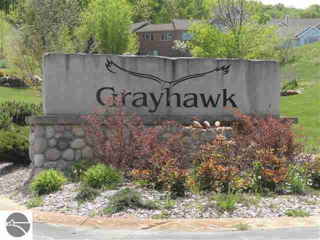 A stone sign that says grayhawk on it