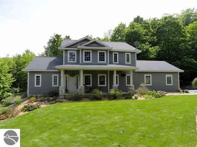 A large house with a large lawn in front of it