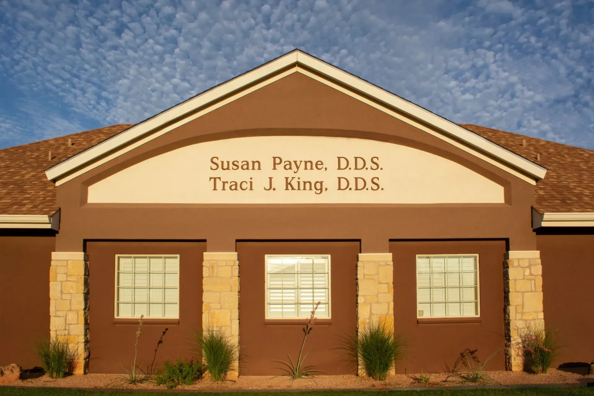 Dental office exterior with sign reading Susan Payne, D.D.S. and Traci J. King, D.D.S.