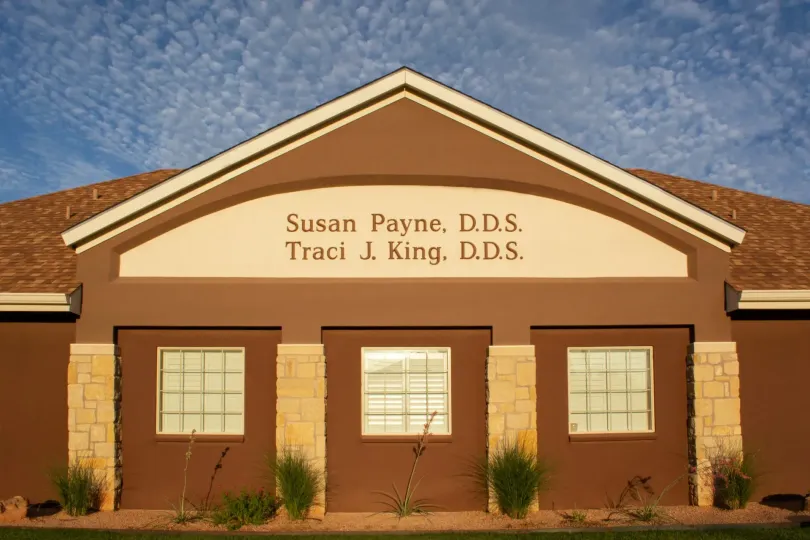 Dental office exterior with sign reading Susan Payne, D.D.S. and Traci J. King, D.D.S.
