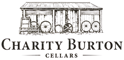 Charity Burton Cellars logo with a rustic barn and wine barrels