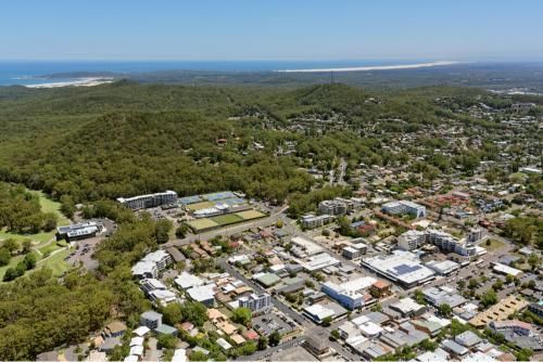 Aerial View of a City Surrounded by Trees and Buildings — Grants Express in Smeaton Grange, NSW