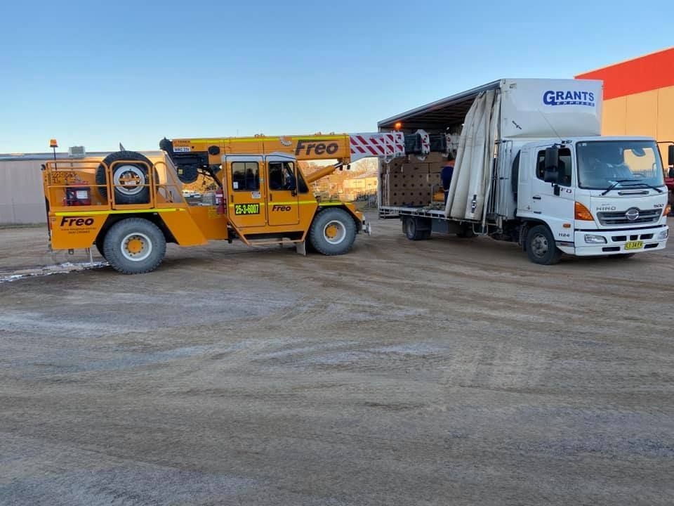 Yellow Truck With the Word Free on It — Grants Express in Bathurst, NSW