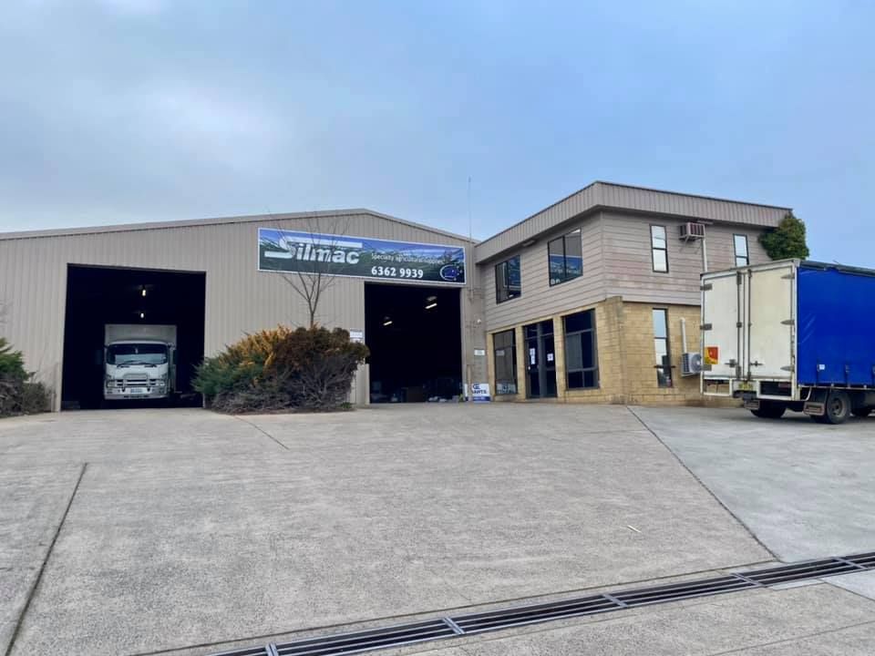 Large Building With a Blue Truck Parked in Front of It — Grants Express in Sydney, NSW
