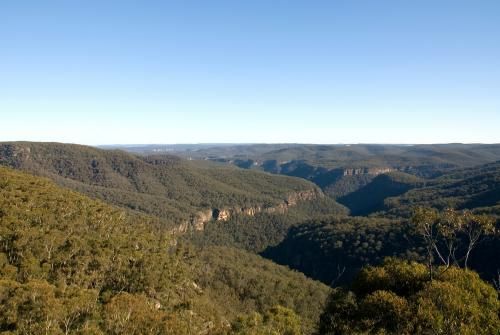 View of a Valley Surrounded by Mountains and Trees on a Sunny Day — Grants Express in Arndell Park, NSW
