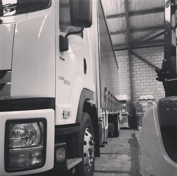 Black and White Photo of a Row of Trucks — Grants Express in Bathurst, NSW