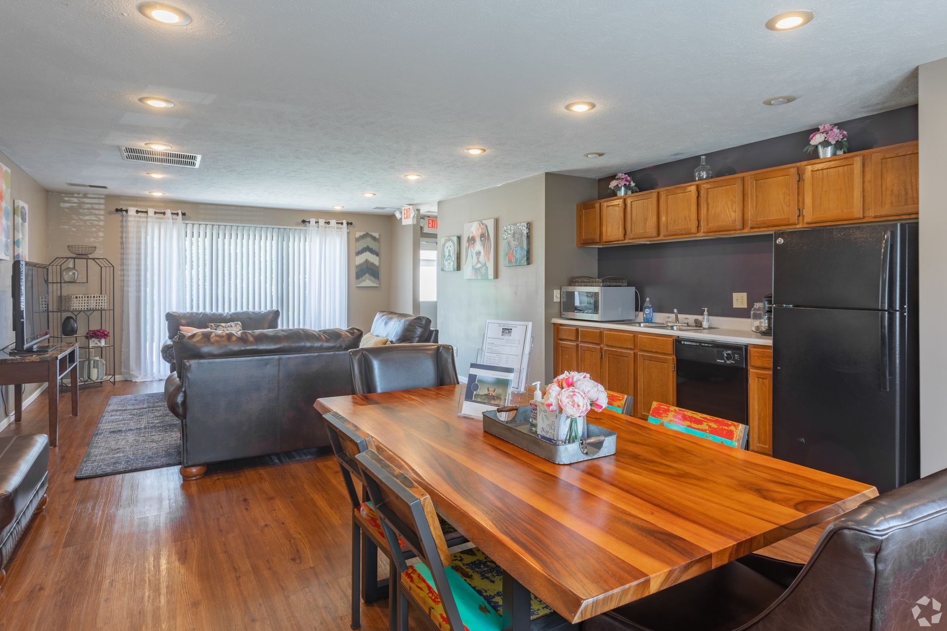 There is a dining table in the middle of the room.