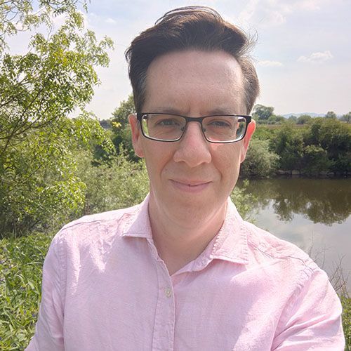 Photo headshot of Alex Grenville