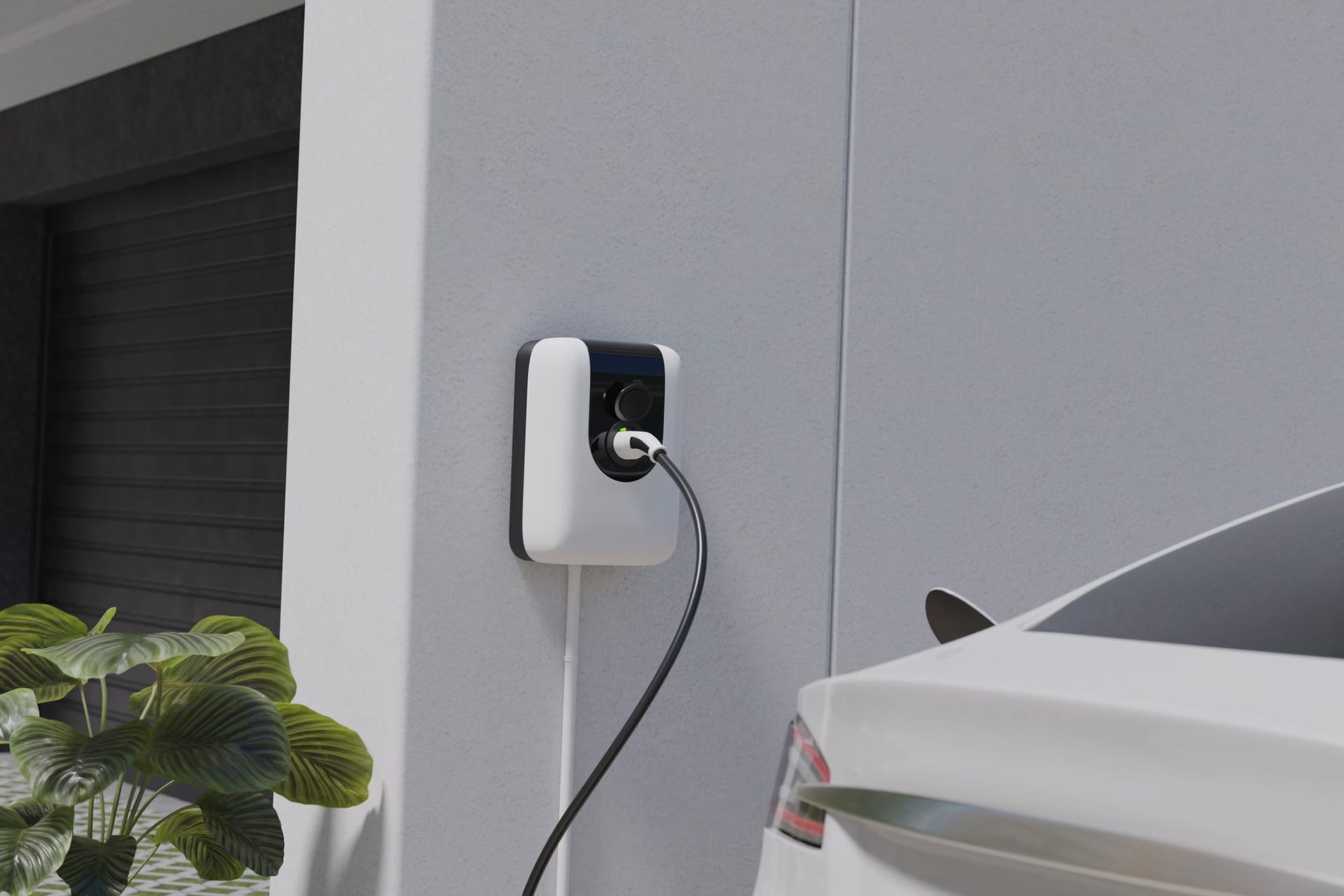 Wall-mounted EV charger plugged into a white car beside a gray garage wall