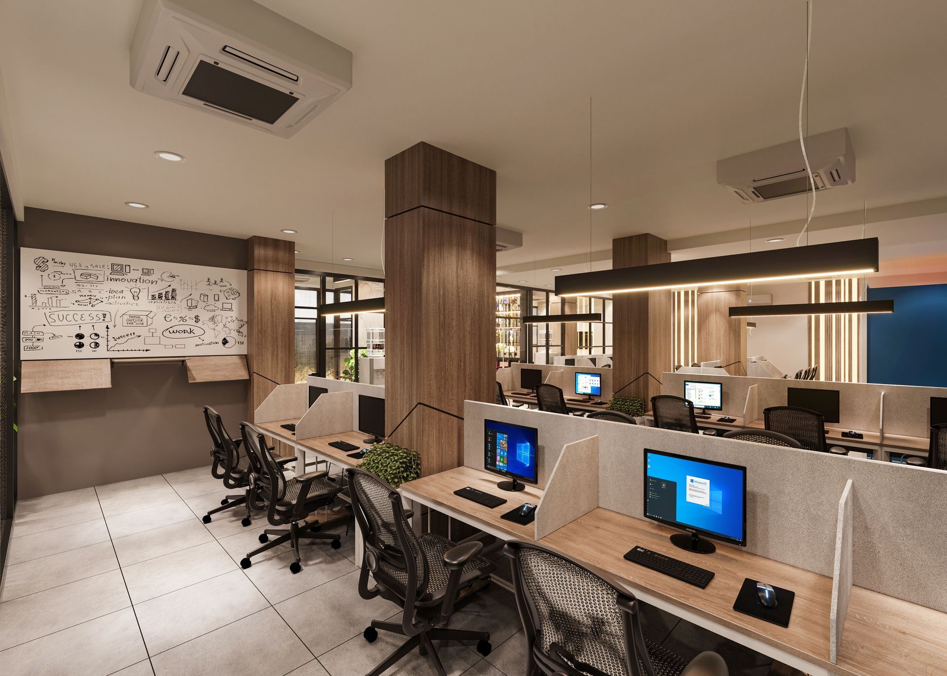 Modern office workspace with rows of desks, computers, and swivel chairs under warm lighting