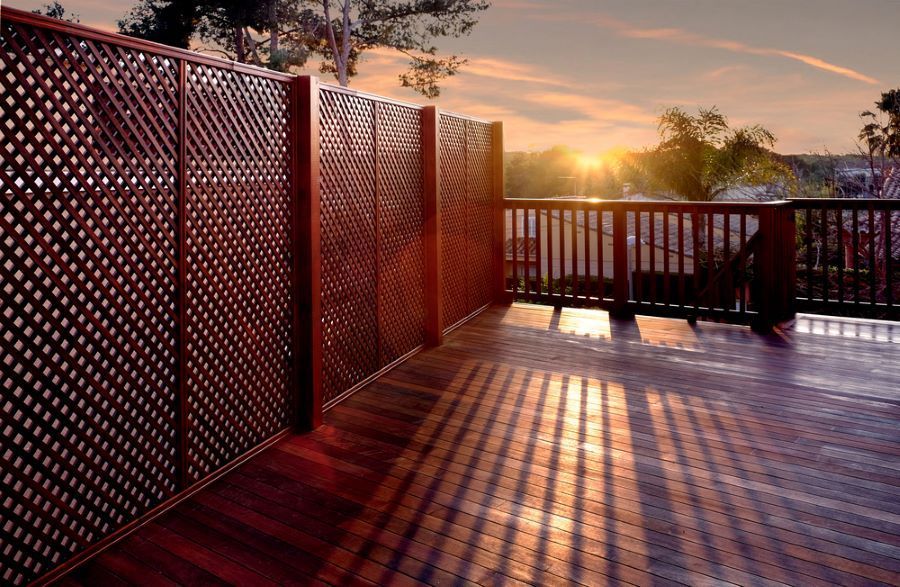 A Deck With a Wooden Fence and a Sunset in the Background — Maroochy Floor Sanding in Nambour, QLD