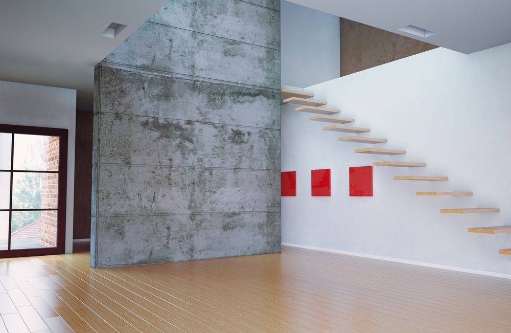 An Empty Room With a Staircase Leading Up to the Second Floor — Maroochy Floor Sanding in Nambour, QLD