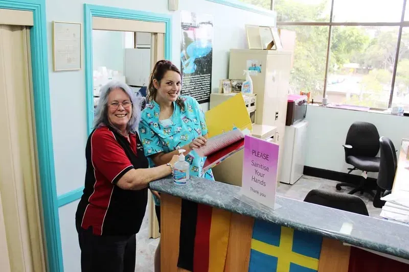 Staff member at the reception of a clinic that make Dentures — Dentures in Toukley, NSW