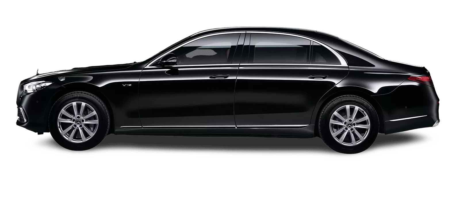 Black luxury sedan in side view on a white background
