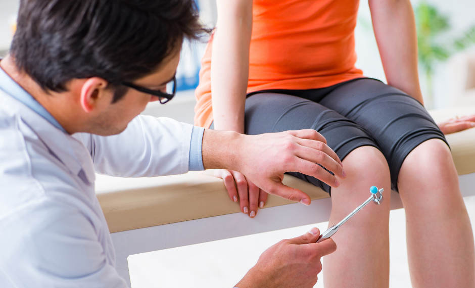 A doctor is examining a patient 's knee with a reflex hammer.