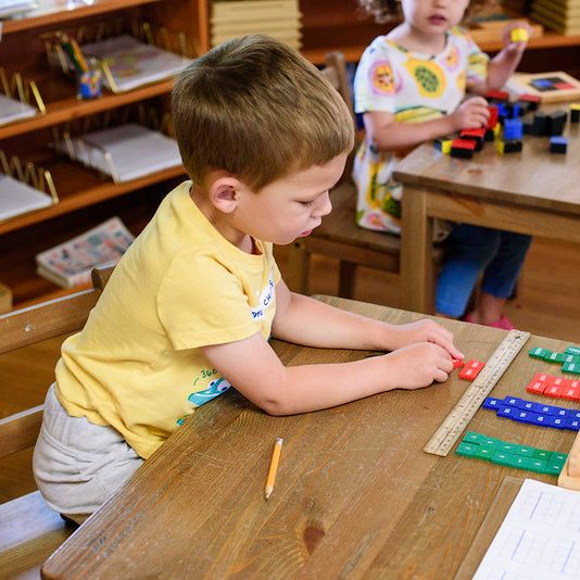 Montessori child working on practical life skills