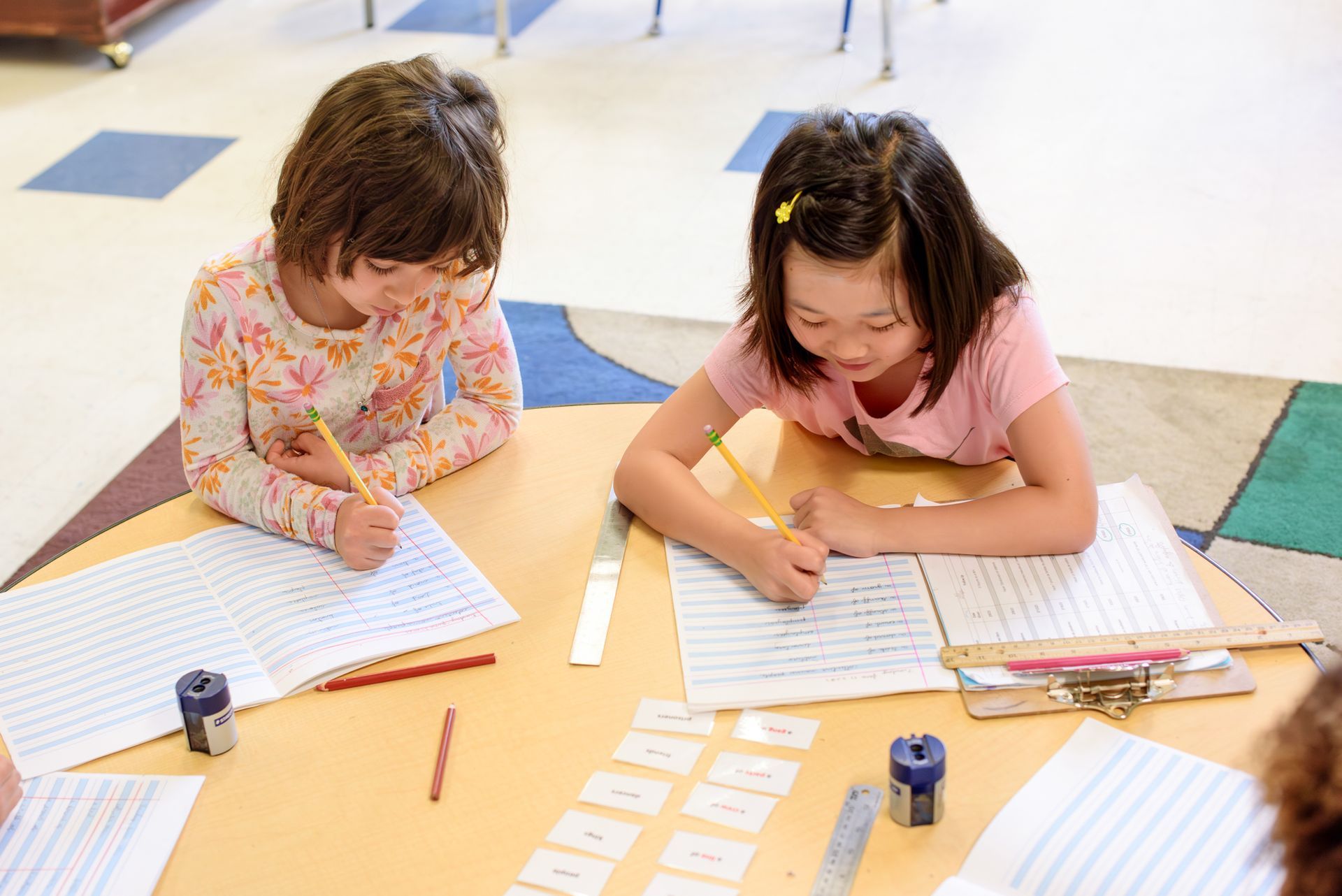 montessori children working with writing activity