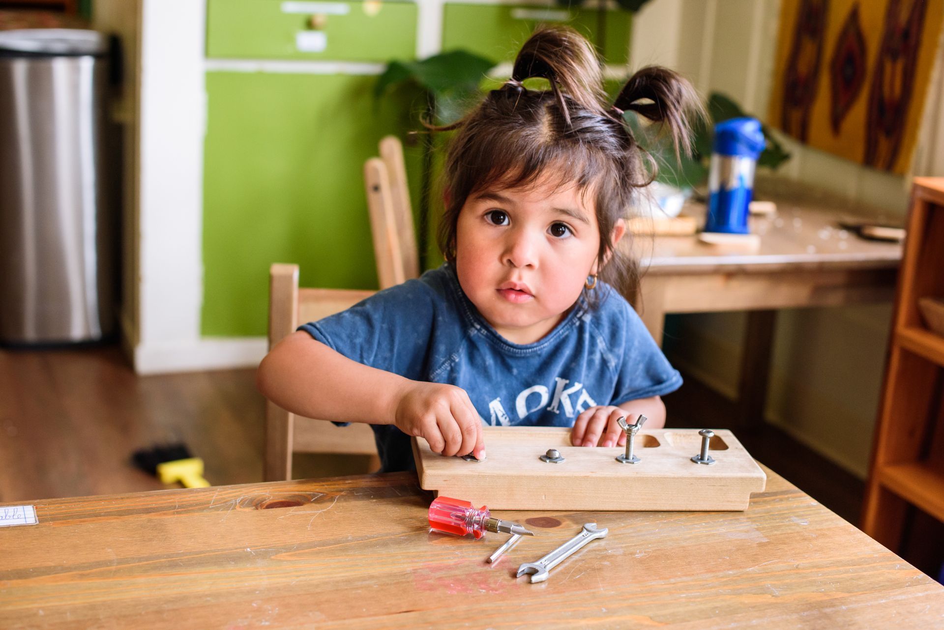 Montessori child working on practical life skills