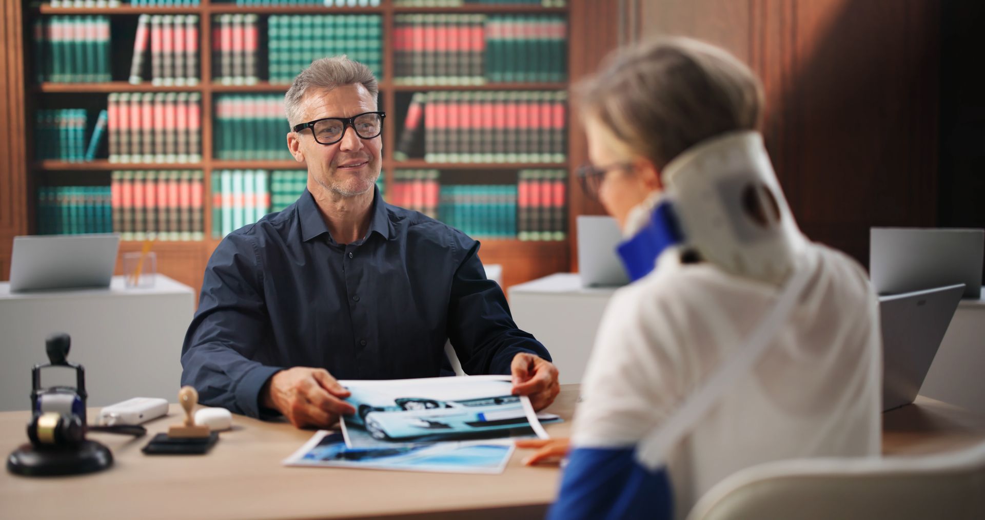 A lawyer is talking to an injured woman.