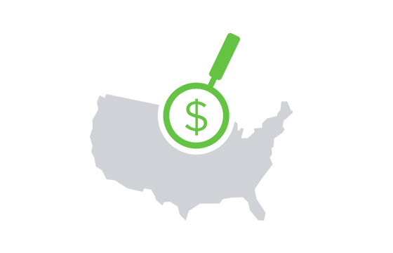 A magnifying glass is looking at a dollar sign on a map of the united states.