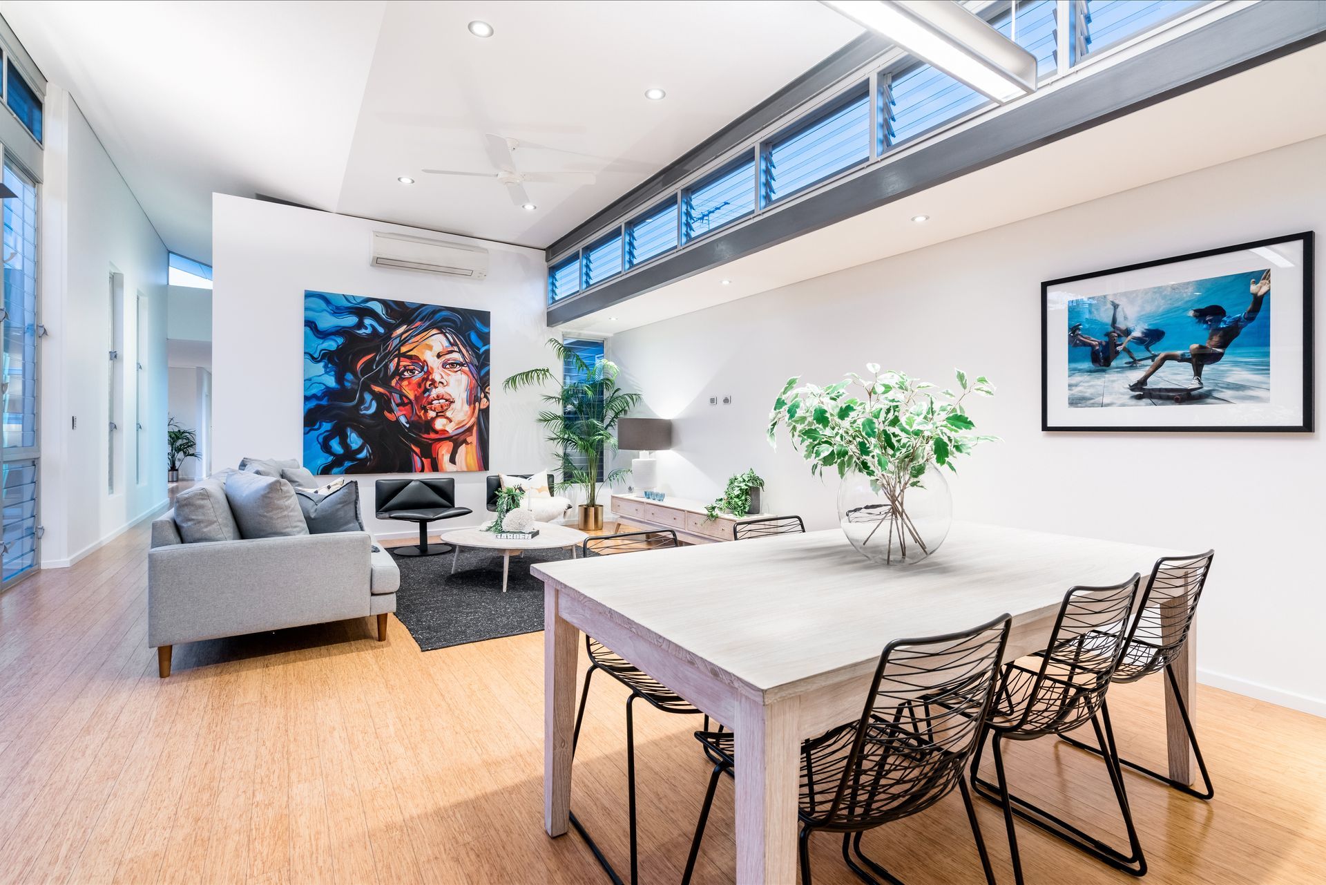 Modern Australian open-plan dining and living area featuring contemporary furniture.