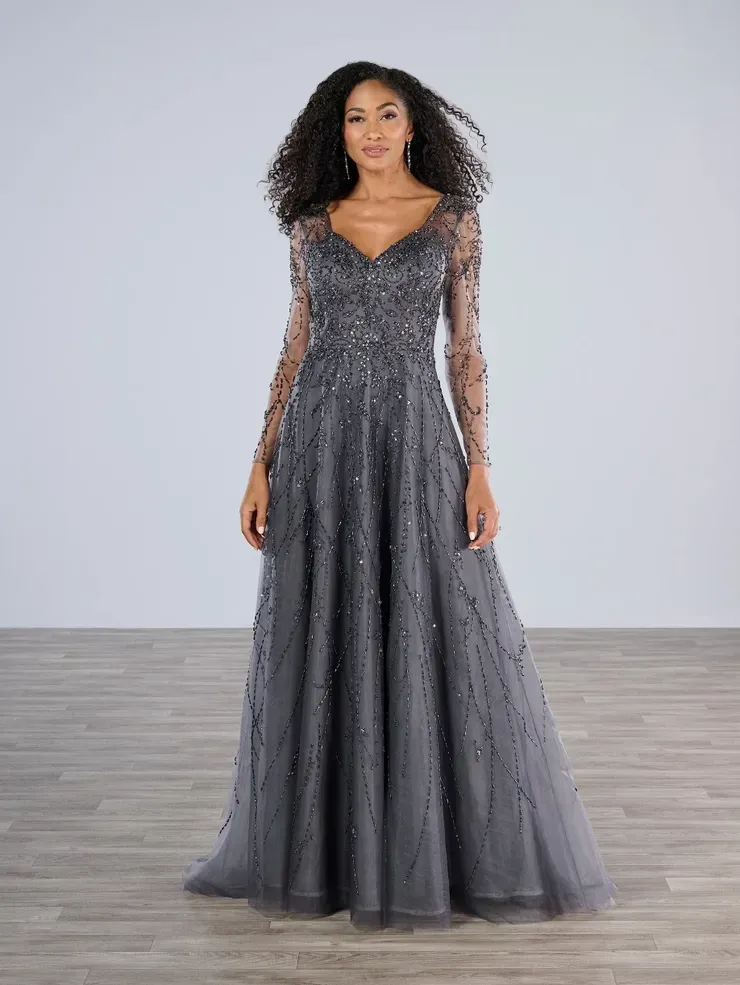 A woman is wearing a long gray dress with long sleeves.