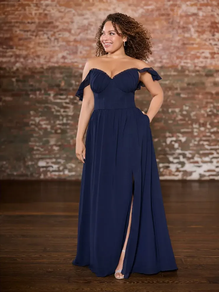 A plus size woman is wearing a blue off the shoulder bridesmaid dress.
