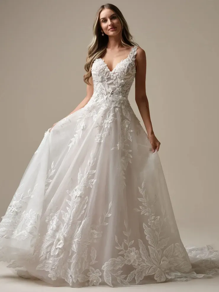 A woman is wearing a white wedding dress with a v-neck.
